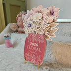 Floral-themed calendar with decorative flowers on a soft surface